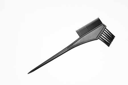 Professional hairdresser's accessories. Hair coloring brush on white background. Hair extensions, materials and cosmetics, hair care, wig. Hairstyle, hair cut salonの写真素材