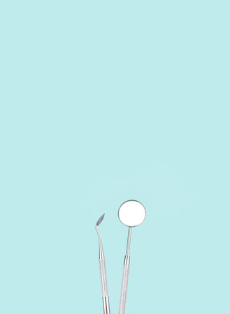 Dentist tools on blue background. Minimal dentistry concept.の写真素材