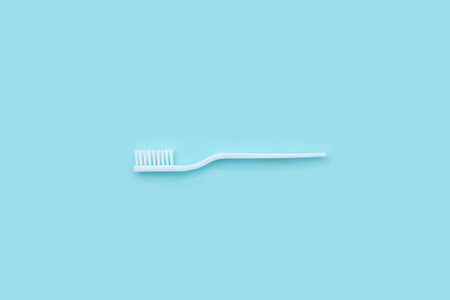 Dentist stomatology medical concept. Oral dental hygiene concept. New white toothbrush on blurred...