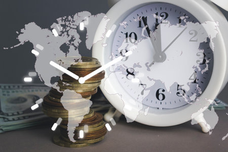 White alarmclock with Coins stack and stack of one hundred dollar bills with Digital Earth planet...