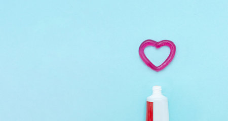 Regular checkups are essential to oral health. Closeup of a toothpaste and toothpaste heart on...