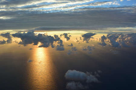 View of sea and clouds from an airplane windowの写真素材