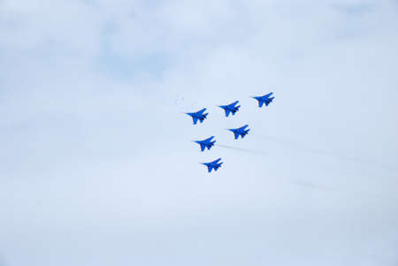 Omsk Russia - 19 March 2016: Performance of aerobatic team Russian Knights at the air show