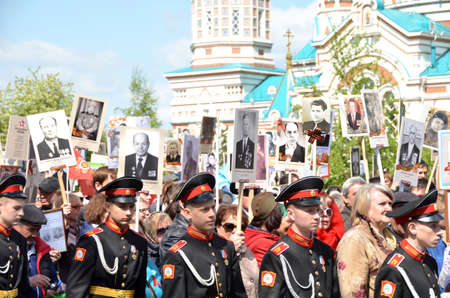 Omsk, Russia - May 9: People rally in honor of those killed in the war 1941-1945 Immortal regiment...