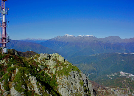 View of the sports hotel complex Rosa Plateau on the background of the Caucasus Mountains. Sochi Russiaの写真素材