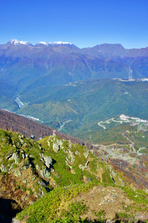 View of the sports hotel complex Rosa Plateau on the background of the Caucasus Mountains. Sochi...