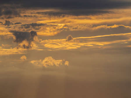 Beautiful multicolored sunset sky with sun rays breaking through the clouds. natural sky background.