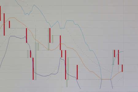 Financial charts on a white background. Abstract financial trading charts of the currency market trading on the monitor. Digital graph background to represent stock market trendsの写真素材