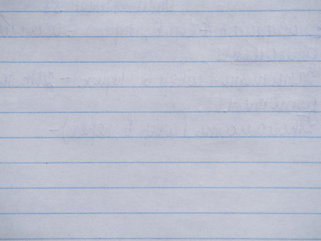 Close-up of a striped notebook sheet. Lined notebook sheet with translucent text, paper background.の写真素材