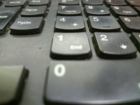 Abstract dark technical background. Close-up of the computational keys of an old computer keyboard, selective focusの写真素材