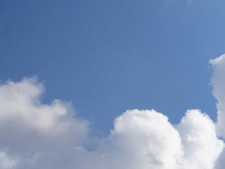 White Cloud and Blue Sky. Beautiful white clouds in sunlight against a blue sky backgroundの写真素材