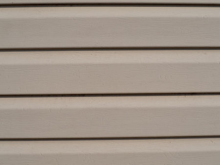 abstract background texture. Beige Vinyl Siding Exterior Plastic Wall Panel. Element of the facade decoration close-upの写真素材