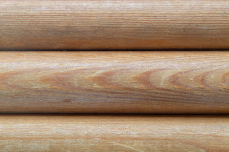 Natural wooden background with soft focus made of parallel wooden logsの写真素材