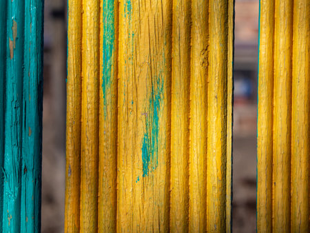 Textured background of paneled boards painted in yellow and blueの写真素材