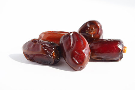 Ripe delicious fruit dates on a white background. date dried fruitsの写真素材