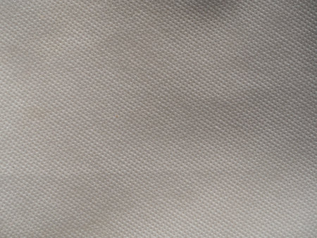Texture of the corrugated surface of non-woven fabric for the backgroundの写真素材