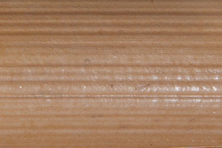 Background texture of the surface of a wooden bamboo board macro photoの写真素材
