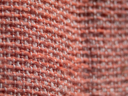 Unfocused texture of a pink knitted background macro photoの写真素材