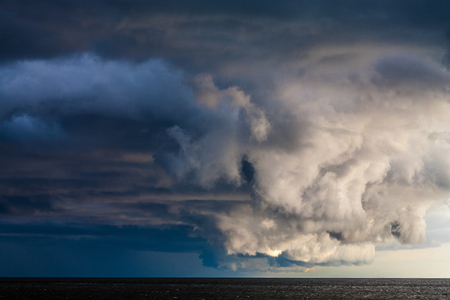 Storm clouds against the background of the sea.の写真素材