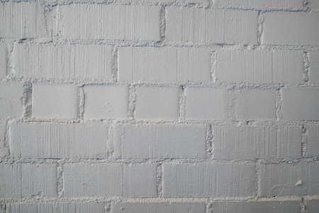 Wall.Painted in white Brick.