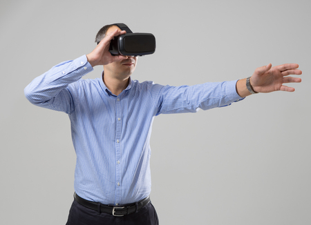 Man uses a virtual reality glasses.の写真素材