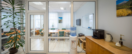 Bright and spacious office with several rooms and a kitchen.の写真素材