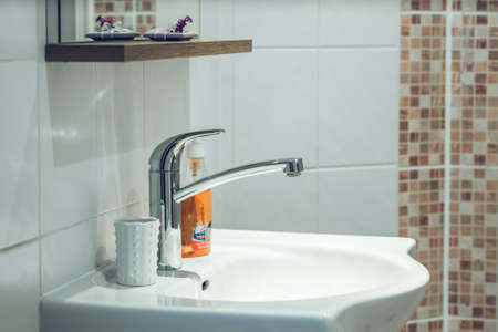 Bathroom interior. White sink. White tile.の写真素材