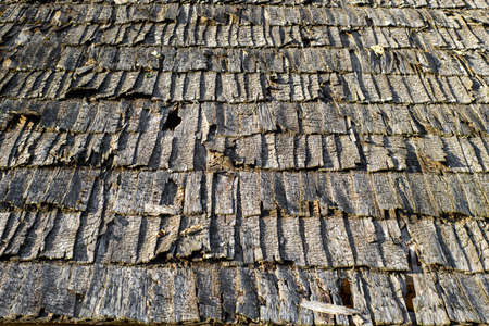 Old roof made of wooden tiles.