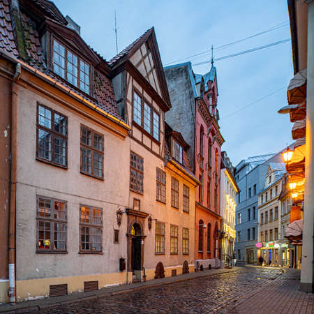 An architecture of Old town in Riga, Latvia. City lighting at evening time. Empty street.