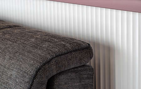 Close-up of armrest. Sofa upholstery detail. Furniture in modern interior of living room.の写真素材