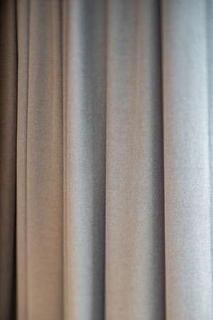 Close-up of grey curtains. Fabric texture. Modern interior. Protect the sunlight in interior.の写真素材