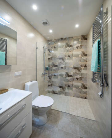 Modern interior of bathroom in apartment. Toilet and shower.