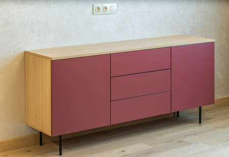 Close-up of wooden stand with drawers and cabinets. Modern interior.の写真素材