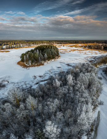 Beautiful winter nature. Scenic landscape. Top drone view of forest.の写真素材