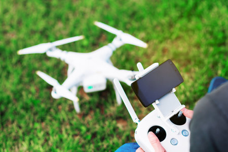 Man controls drone on the streetの写真素材