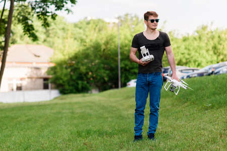 Man controls drone on the streetの写真素材