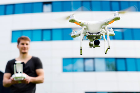 Man controls drone on the streetのeditorial素材