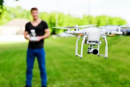 Man controls drone on the street