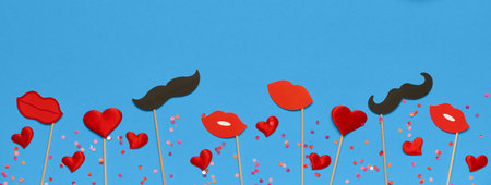 Valentine's day banner template with red lips, valentine gift, decor on blue background with copy...