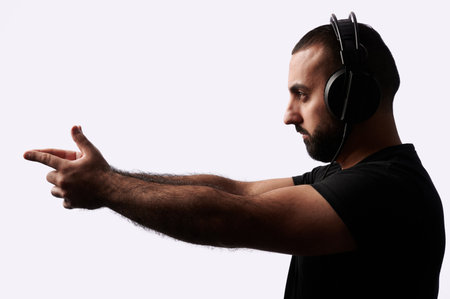 Young arabian man dj with headphones on isolated backgroundの写真素材