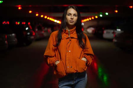 Young fashionable woman hipster walking in the city and parking