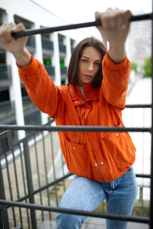 Portrait of young beautiful fashionable woman hippy in red jacket in the summer near the summer...