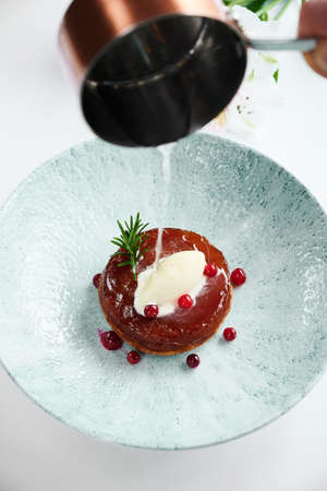 Tasty beef steak Meat with cranberry on the plate