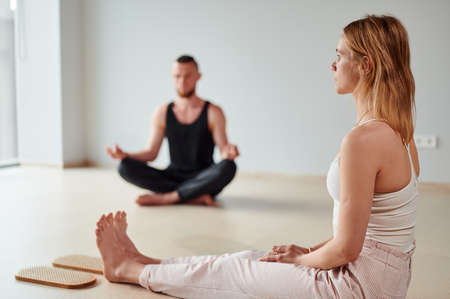 Group of people meditation after yoga practice of standing on sadhu board with shapr nails. Alternative medicine acupressure, recovery strengthの写真素材