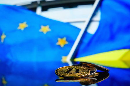 Bitcoins on the background of the flag European Union and Ukraine. Concept for investors in...