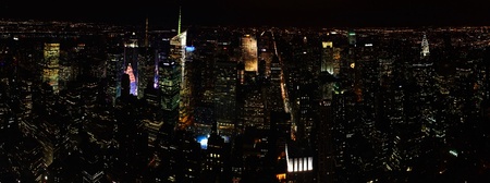Panoramic view of night city with many skyscrapers