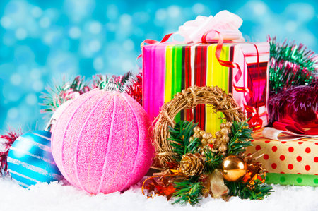 Christmas background with a blue ornament, gift box,  snowの写真素材