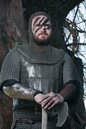 Brave warrior viking in the autumn forest.の写真素材
