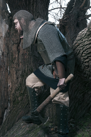 Brave warrior viking in the autumn forest.の写真素材