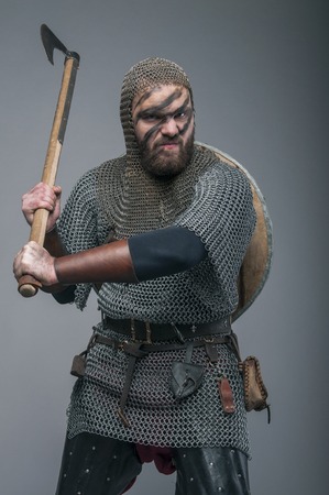 Harsh viking with axe on his shoulder after the battleの写真素材